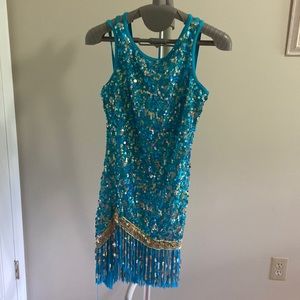 Turquoise and gold sequins jazz costume with fringe at the bottom